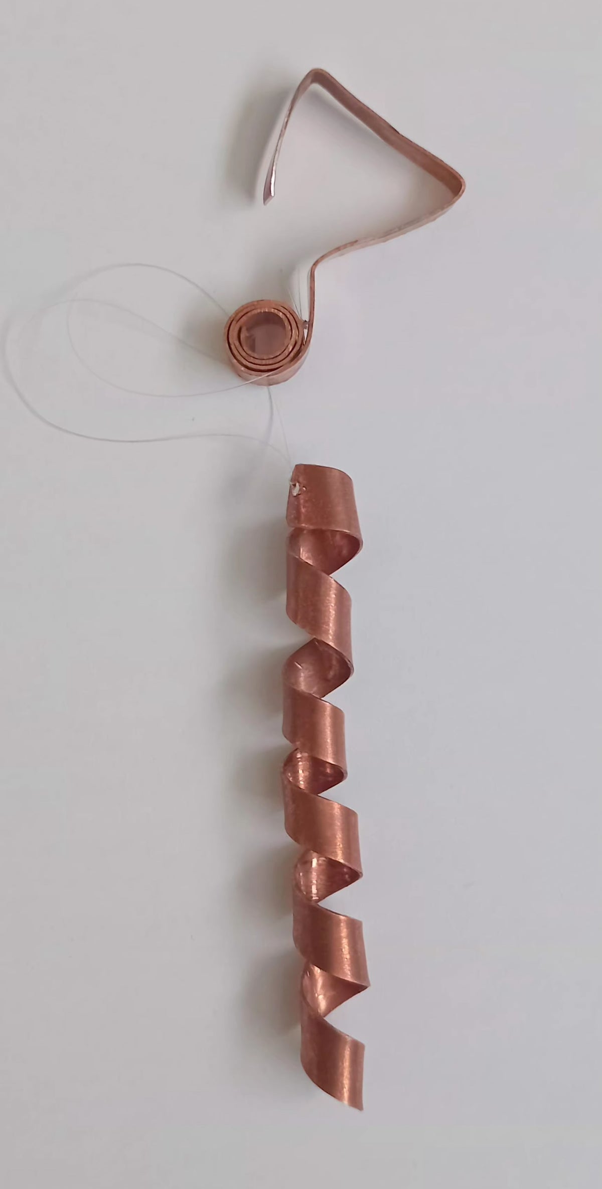 Spirale in rame porta desideriI per Genese e Pentasfere